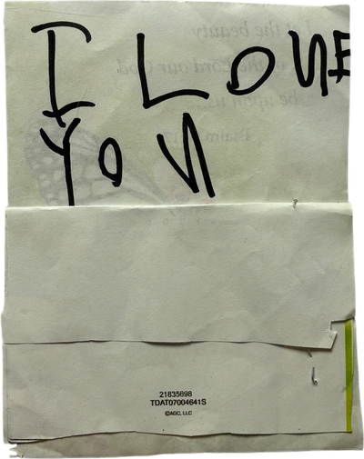 folded paper reading i love you