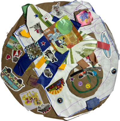 heavily decorated cardboard replica of robot vacuum cleaner named steve