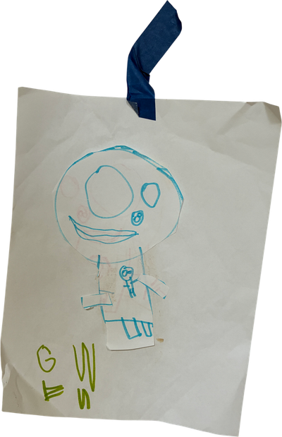 drawing person cut out and pasted onto paper